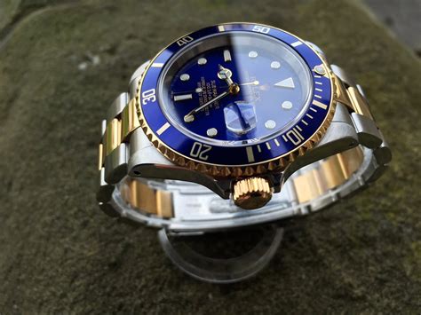 rolex submariner date gold steel blue dial|Rolex Submariner blue dial bezel.